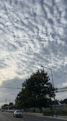 Wichit street under a dramatic cloud-filled morning sky