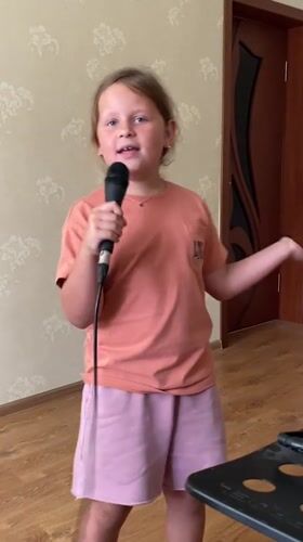 Home karaoke session in a Gulkevichi living room