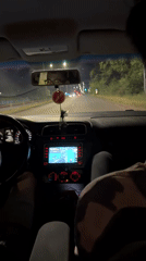 Passenger documents nighttime drive through Burgas, Bulgaria