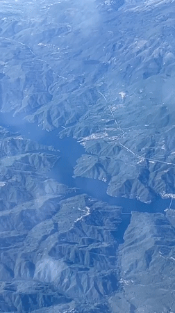 Aerial footage captures mountainous landscape over Carsoli, Italy