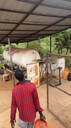 Customer refills gas cylinder at Abuja filling station