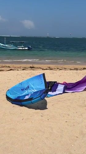 Kiteboarding and wing surfing session on a Bali beach
