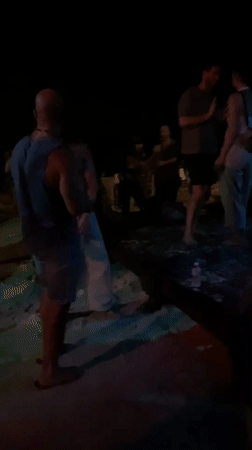 Nighttime beach party documented in Koh Phangan, Thailand