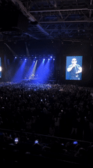 Concert draws packed crowd in Krasnoyarsk venue with blue stage lighting