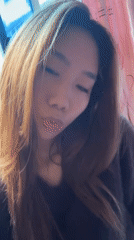 Woman takes multiple selfies in Hechuan, China morning session