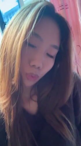 Woman takes multiple selfies in Hechuan, China morning session