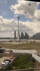 Train passenger films London cable car system from window