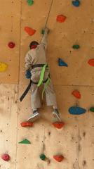 Children rock climb at indoor facility in Izhevsk, Russia