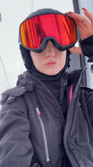 Skiers ride gondolas at mountain resort during morning hours
