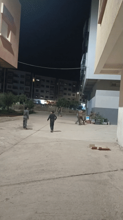 Evening play activities captured in residential Meknès neighborhood