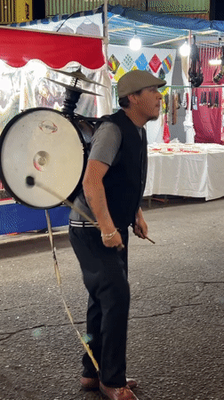 Drummers perform at nighttime street festival in Arica, Chile
