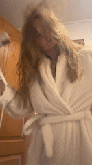 Morning routine captured: hair drying and breakfast cooking in Ukraine