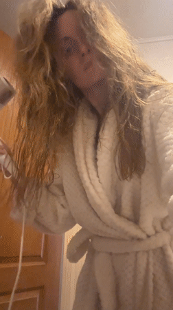 Morning routine captured: hair drying and breakfast cooking in Ukraine