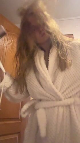 Morning routine captured: hair drying and breakfast cooking in Ukraine