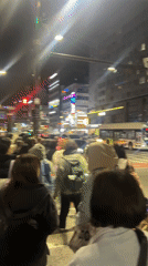 Pedestrians cross busy crosswalk in Goyang-si, South Korea