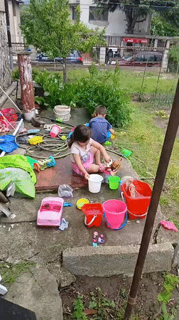 Family life documented in Bulgarian village garden scenes