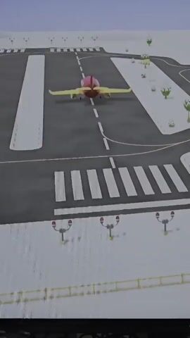 This media file depicts an animated scene at an airport, seemingly for children. The first segment shows a bright red and yellow airplane on a runway, with stylized snow-covered trees and landing lights visible. The sky is a pale blue. The second segment transitions to a colorful building with a large purple archway, resembling a hangar or terminal. A green truck with a ramp, likely a baggage or passenger loader, is parked in front of the building. The truck has a cartoonish ice cream cone on its side. A close-up shot reveals the face of a character, possibly a pilot or air traffic controller, with large grey eyes, a pink face, and a headset. The character has a slight smile. The background includes shelves with colorful items and a screen displaying bar graphs. The overall tone is cheerful and playful, suggesting a bright, possibly daytime setting. There is no visible text within the media, apart from a faint "LG" logo at the bottom of the screen, indicating the display device. The context of Kilkenny, Ireland is not visually represented in the animation itself.