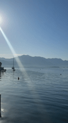 Child photographed at serene Montenegro waterfront dawn