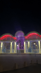 Modern building illuminated at night in Шебунино, Russia