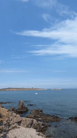 Sozopol's rocky Black Sea coastline on a calm summer morning