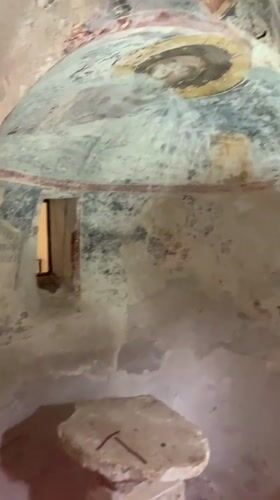 Visitor documents historic Pitsunda Cathedral and museum complex tour