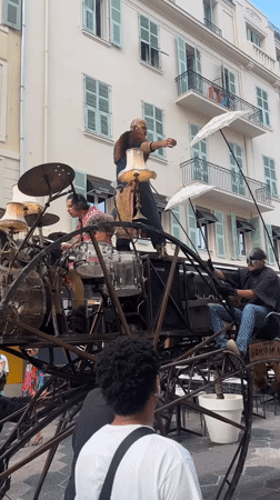 Ornate wheeled sculpture draws a crowd in Nice streets