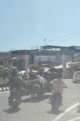 Morning traffic on a commercial street in Lhokseumawe