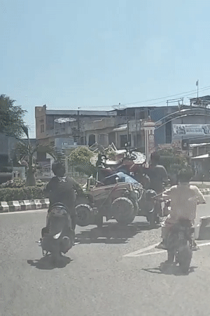 Morning traffic on a commercial street in Lhokseumawe