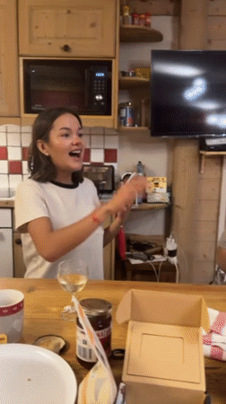 Woman makes video call, shares meal in French Alps kitchen