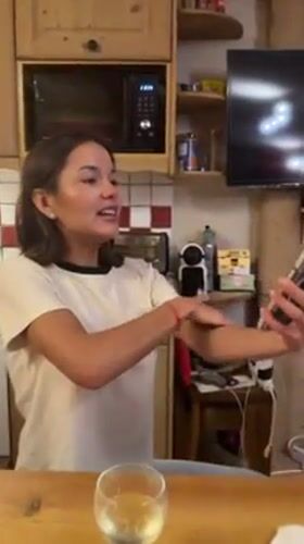 Woman makes video call, shares meal in French Alps kitchen