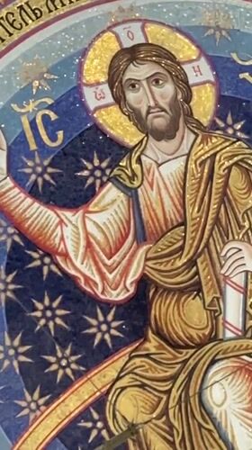 Ornate orthodox church interior in Belgrade, opening on mosaic