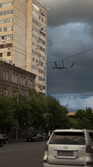 Street documentation captures Soviet-era buildings under stormy Yerevan sky