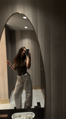 Woman takes mirror selfies in Budva, Montenegro