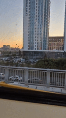 Riding Astana's elevated light rail through a modern city skyline
