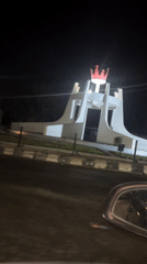 Illuminated white monument with red crown spotted in Jos roundabout