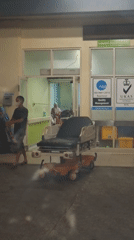 Overnight activity outside Banda Aceh hospital, ambulances and people present