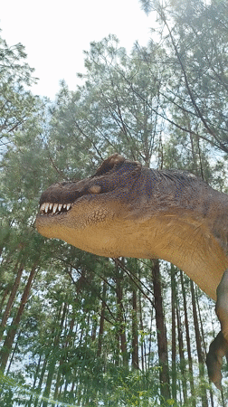 Realistic T. Rex model looms among Da Lat's pine trees