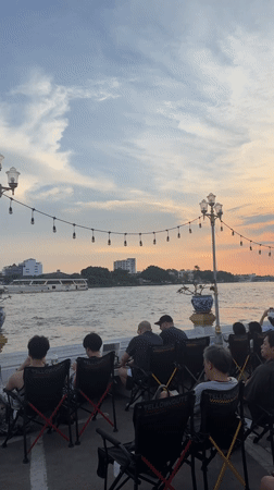 Casual street scenes and riverside gathering documented in Bangkok