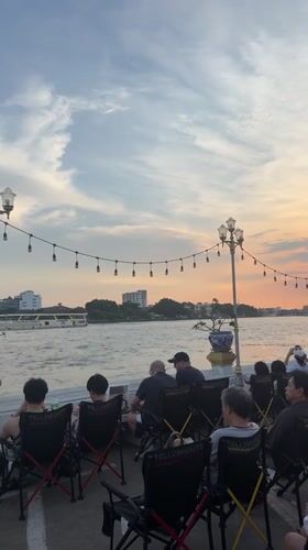 Casual street scenes and riverside gathering documented in Bangkok
