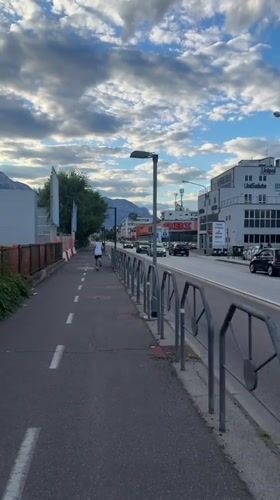Evening run along a Trento street in summer