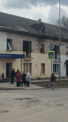Teenagers gather on Perm sidewalk during overcast morning