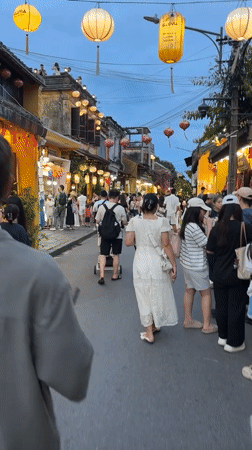 Hoi An's lantern-lit streets buzzing with evening street food crowds