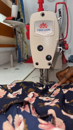 Sewing session in Ado, Nigeria, stitching floral fabric