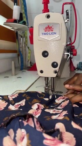 Sewing session in Ado, Nigeria, working through patterned fabrics