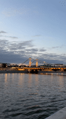 Dusk along the Moscow River, Krymsky Bridge glowing at golden hour