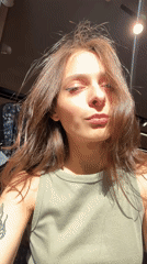 Woman takes selfies in Krasnoyarsk sporting goods store