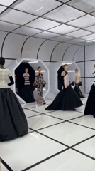 Fashion show features ballgowns in geometric London venue