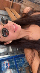 Woman takes playful selfies at Plovdiv cafe