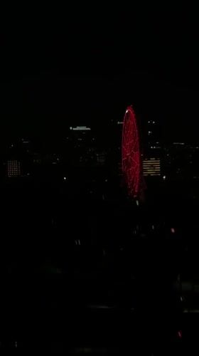 Red Ferris wheel lights up Mexico City night skyline