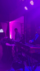 Musicians perform at Montenegro bar with outdoor crowd gathering